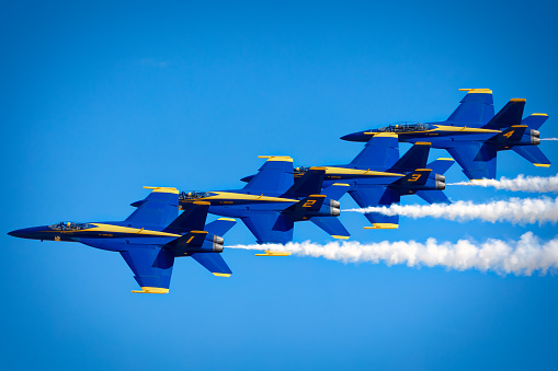 San Francisco, United States – October 07, 2023: Four airplanes flying in formation while emitting trails of white smoke in the sky