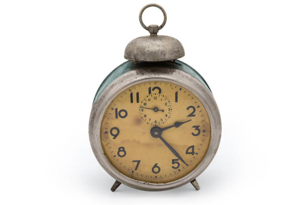 istock Old vintage mechanical analog alarm clock on a white background 1642574817