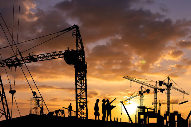 istock Silhouette of engineer and construction team working at site 1642575337
