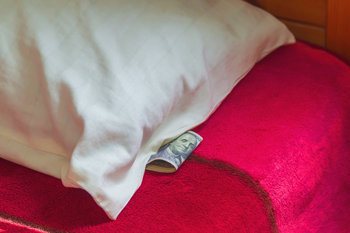 Panic and a crash in the stock market are forcing investors to cash in and keep cash under their pillows or mattresses, a time-honored method even though inflation eats away at some of them each year.