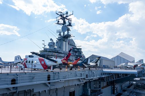 American aircraft carrier anchored in a harbour after offshore training exercises.