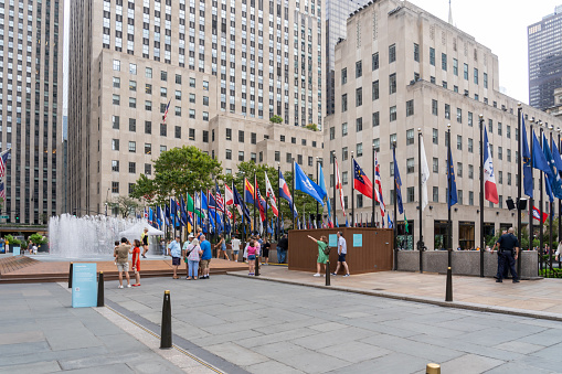 People at Rockefeller Center Plaza in New York City, NY, USA, August 21, 2022. Rockefeller Center is a large complex consisting of 19 commercial buildings.