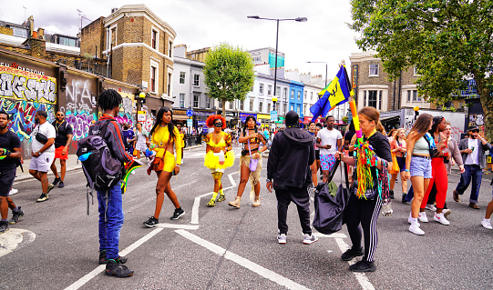 Notting Hill Carnival stock photo. Dates: Aug 27 – Aug 28, 2023.\nMusic festival. The Notting Hill Carnival is an annual Caribbean Carnival event that has taken place in London since 1966 on the streets of the Notting Hill area of Kensington, each August over two days. Traditionally the iconic Notting Hill Carnival is held over the August bank holiday weekend.\n\nNotting Hill Carnival – August 27, 2023.