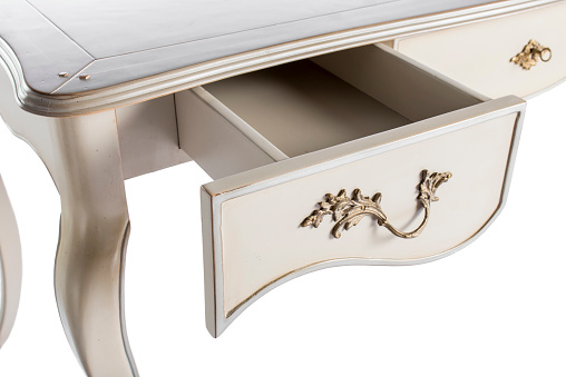 open drawer in a wooden cabinet of furniture, accessories shot close-up
