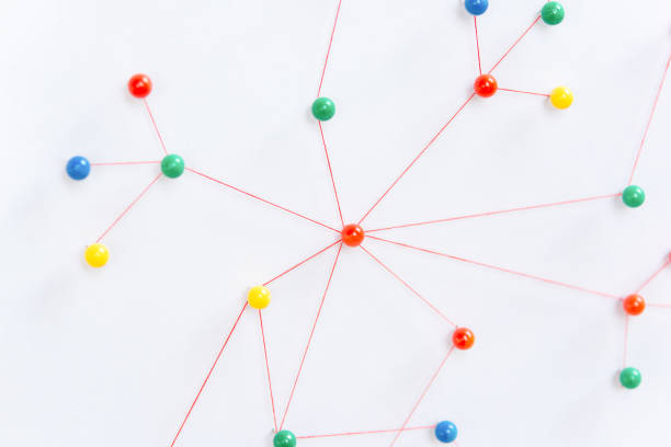 istock Linking entities, Blockchain, social media, Communications Network, The connection between the two networks. Network simulation on paper linked together by yarn 1642611385