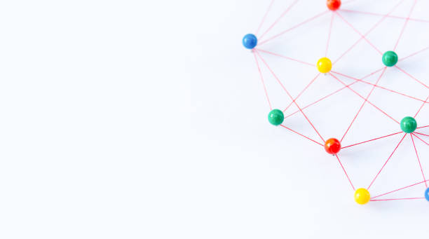 istock Linking entities, Blockchain, social media, Communications Network, The connection between the two networks. Network simulation on paper linked together by yarn 1642611483
