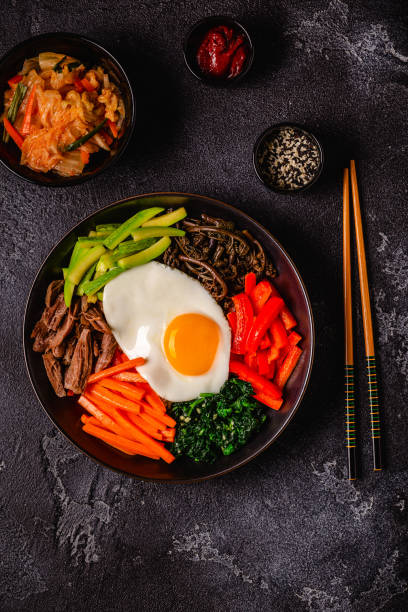 istock Traditional Korean dish Bibimbap: rice with vegetables beef and egg. 1642632484