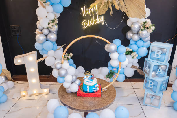 istock one year birthday decoration with white and blue balloons from different angle 1642633061