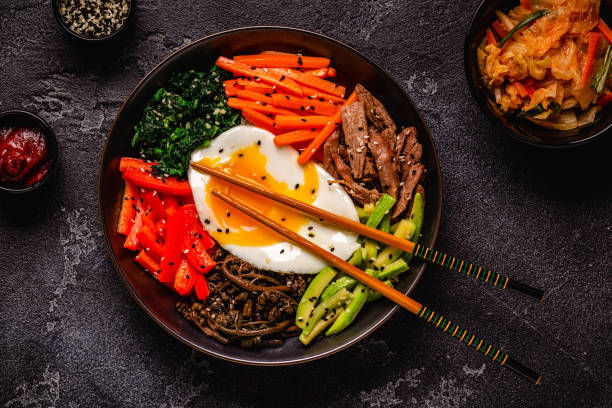 istock Traditional Korean dish Bibimbap: rice with vegetables beef and egg. 1642634162
