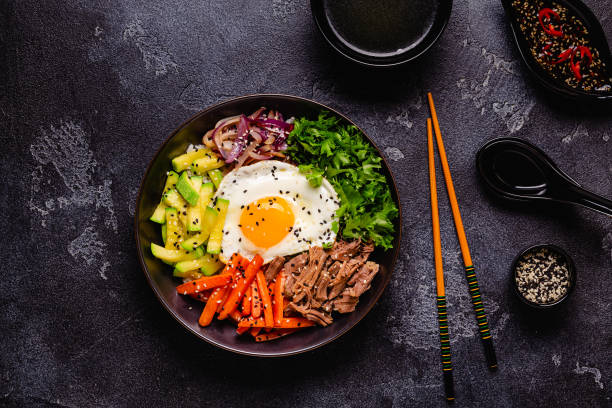 istock Traditional Korean dish Bibimbap: rice with vegetables beef and egg. 1642634163