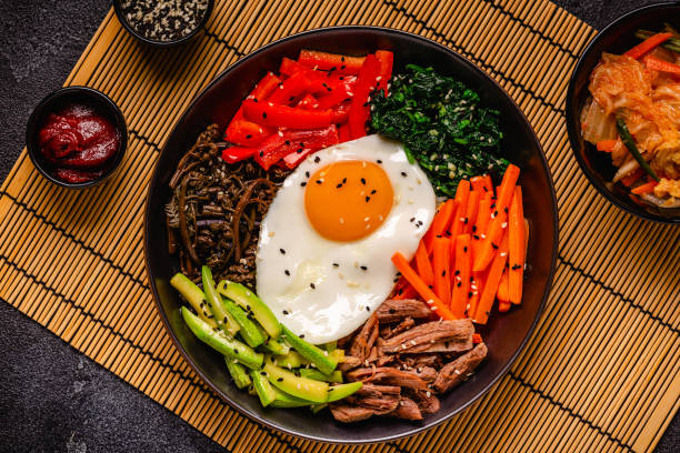 istock Traditional Korean dish Bibimbap: rice with vegetables beef and egg. 1642634168