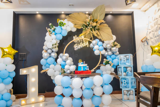 istock one year birthday decoration with white and blue balloons from different angle 1642634772