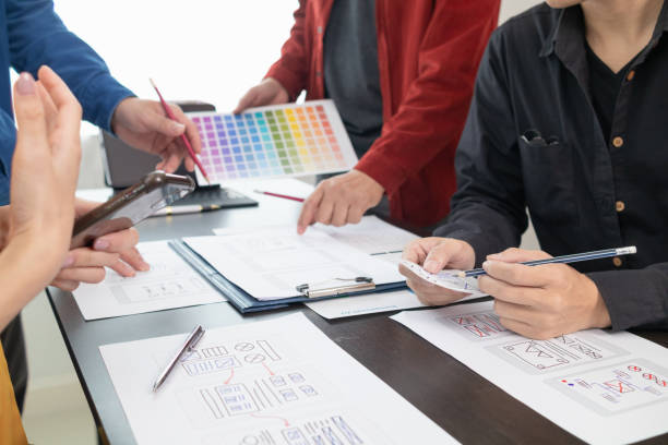 istock team of UI UX web designer are working together to develop mobile responsive websites with UI UX front end designer previews, UI UX web development ideas, front end designer. application development 1642636529