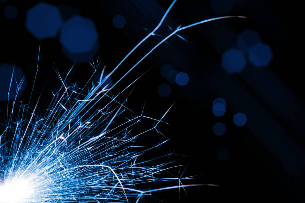 istock Sparkler in blue and white light on a black background 1642648100
