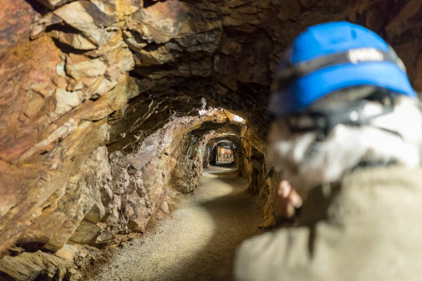 Water flowing through a dark and mysterious flooded mine tunnel, showcasing the remnants of past mining activities in hidalgo, mexico