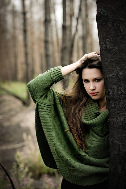 istock Young woman standing near tree 164268195