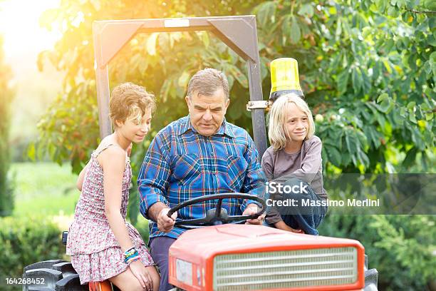 Grandfather With Grandchildren On The Tractor Stock Photo - Download Image Now - Family, Vineyard, 14-15 Years