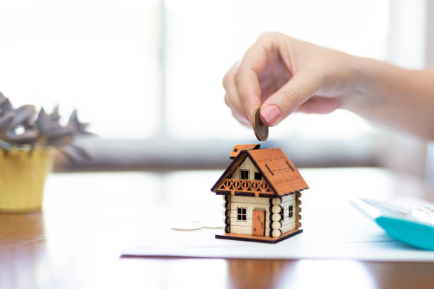 istock Real Estate Agent with house model and saving concepts 1642691570