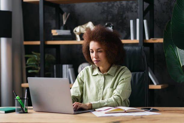 istock Concentrated successful business woman working in office using laptop 1642732569