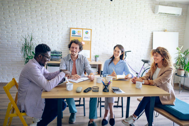 istock Colleagues having team meeting at modern office 1642736753