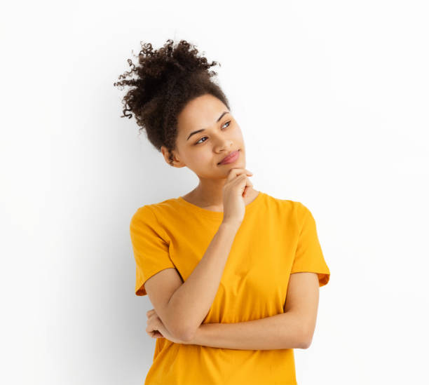 istock Dreamy woman looking empty space standing isolated white color background 1642745871
