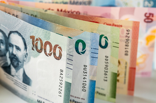 Mexico money, mexican pesos, stacked various banknotes, 1000 pesos banknote, financial business concept