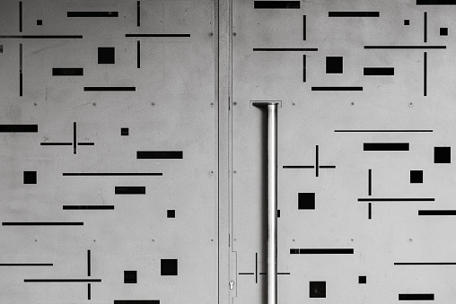 Metal door with grey steel handle, locked