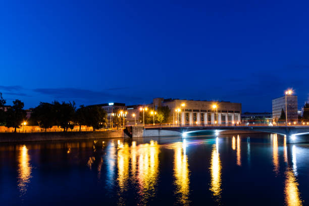 istock Night city reflecting in the river 1642782914