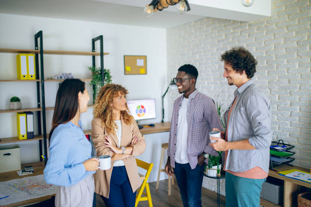 istock Colleagues talking together while having coffee break at the modern office 1642801162