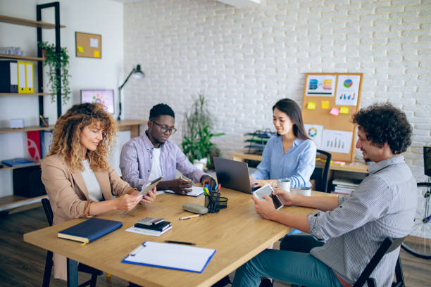 istock Colleagues having team meeting at modern office 1642805464