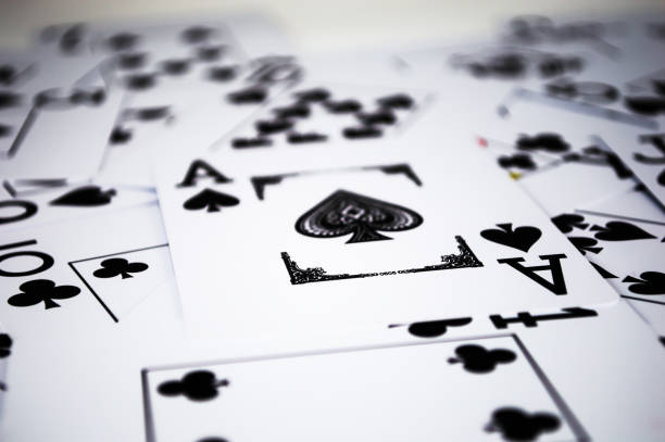 istock Black playing cards in chaos 1642806012