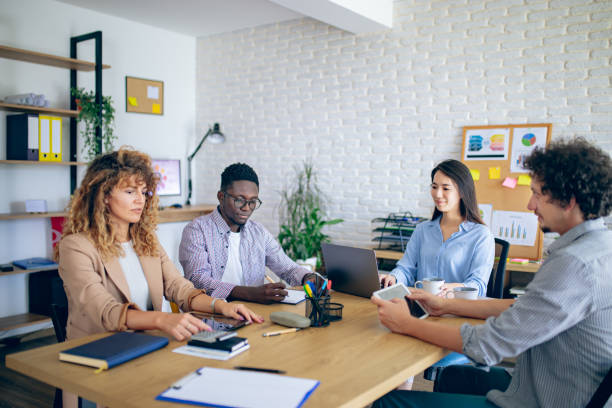istock Colleagues having team meeting at modern office 1642813043