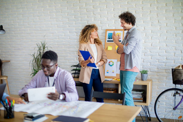 istock Colleagues working together at the office 1642840046