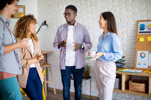 istock Colleagues talking together while having coffee break at the modern office 1642852704