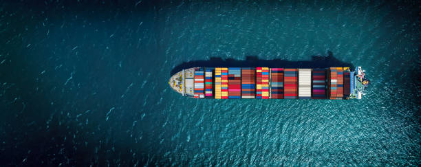 istock Industrial import-export port prepare to load containers. Aerial top view container ship in export and import global business and logistic. Global transportation and logistic business. 1642859092