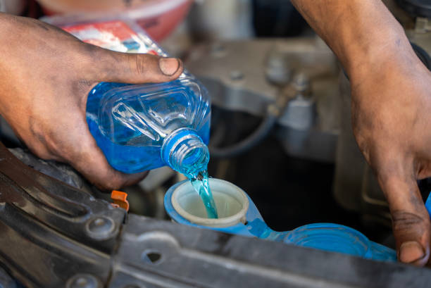 istock putting water in your windshield wiper fluid 1642872875