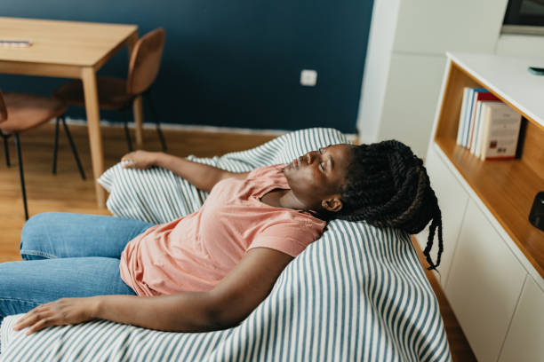 istock One black woman applying the nasal drops 1642891879