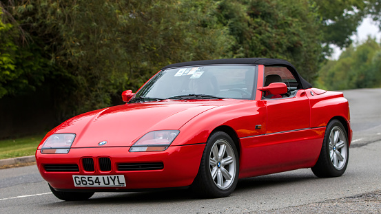 Whittlebury,Northants,UK -Aug 26th 2023: 1990 red BMW Z1 sports car travelling on an English country road