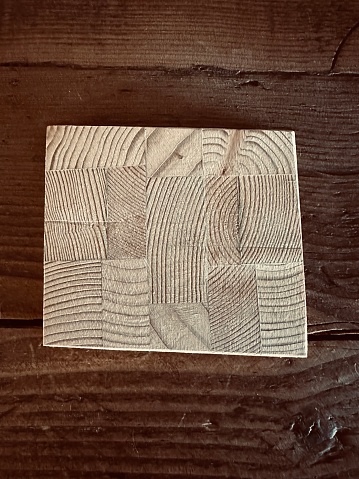 Wooden pattern place mat on wooden table