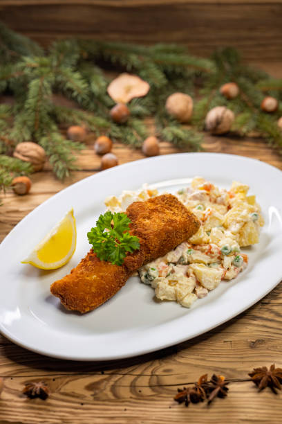istock Christmas fried carp with potato salad 1642941543