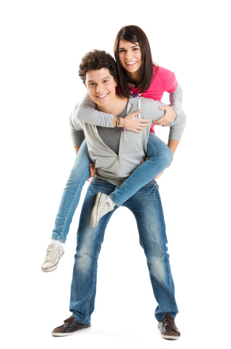 Young Couple Enjoying Piggyback Ride Isolated On White Background.