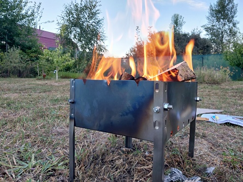 Metal brazier for ignition of the firewood for shish kebab