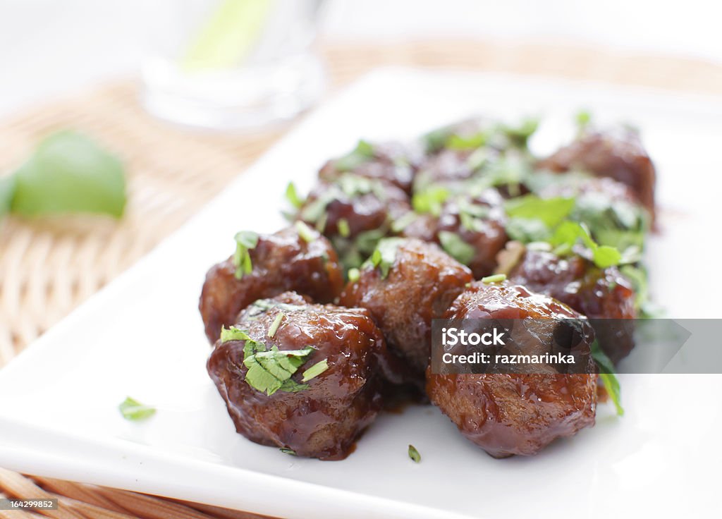 Plate of meatballs in gravy with herbs Plate of meatballs in gravy with herbs horizontal Meatball Stock Photo