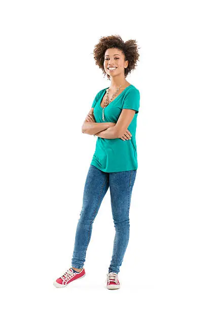 Photo of Smiling young woman in green t-shirt and blue jeans