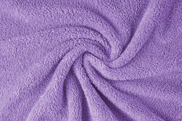 istock Terry cloth, violet towel texture background. Soft fluffy textile bath or beach towel material 1643044342