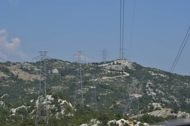 istock Electricity grid poles in countryside. 1643049528