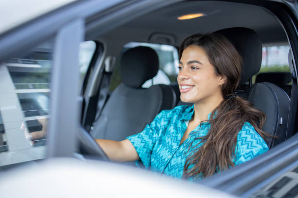 istock Woman is driving a car on her way to work 1643052821