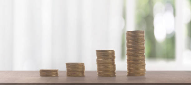 istock Stack of coin with trading graph, financial investment 1643054696