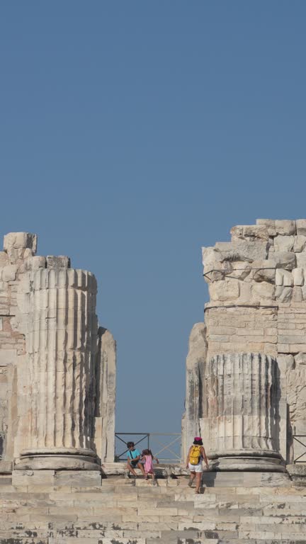 4k video of mother, son and daughter in ancient Greek city ruins