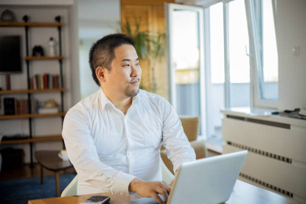 istock Young fashionable man working at home 1643254242